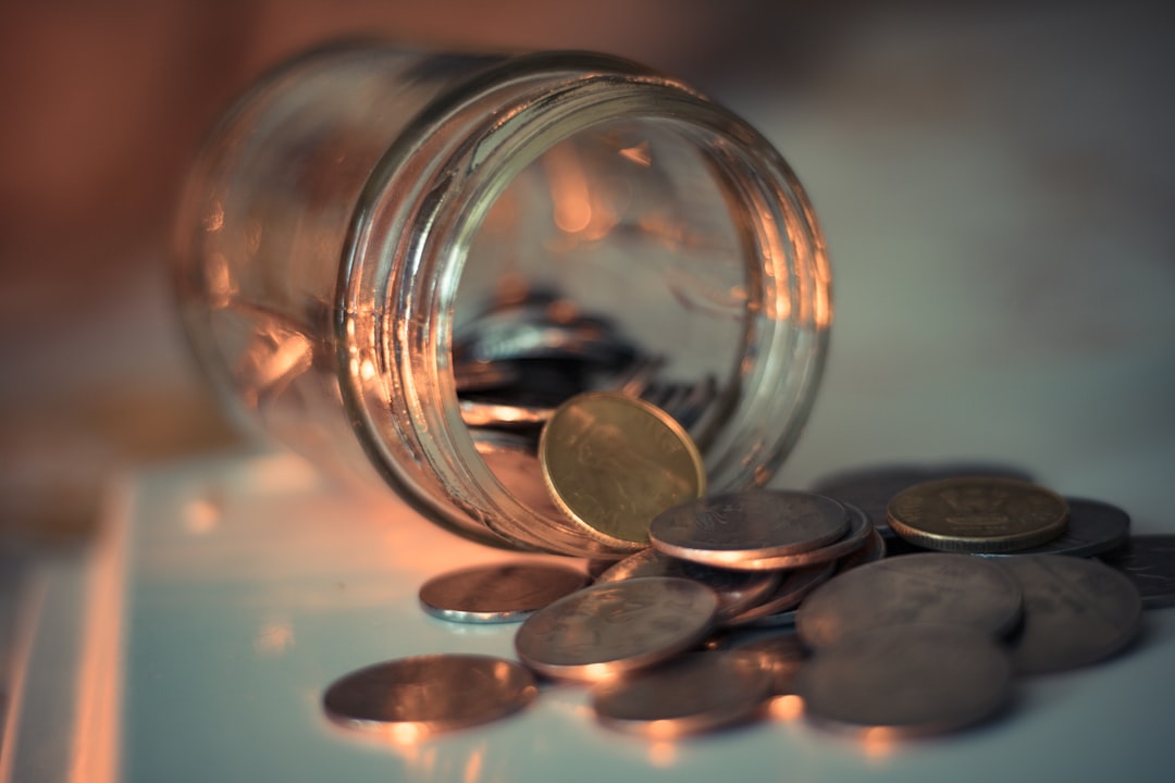 clear-glass-jar-with-coins-xmvqvecdsqi